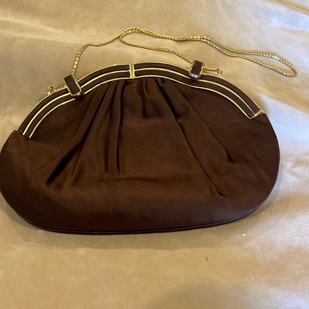 Judith Leiber brown evening bag with gold trim.
